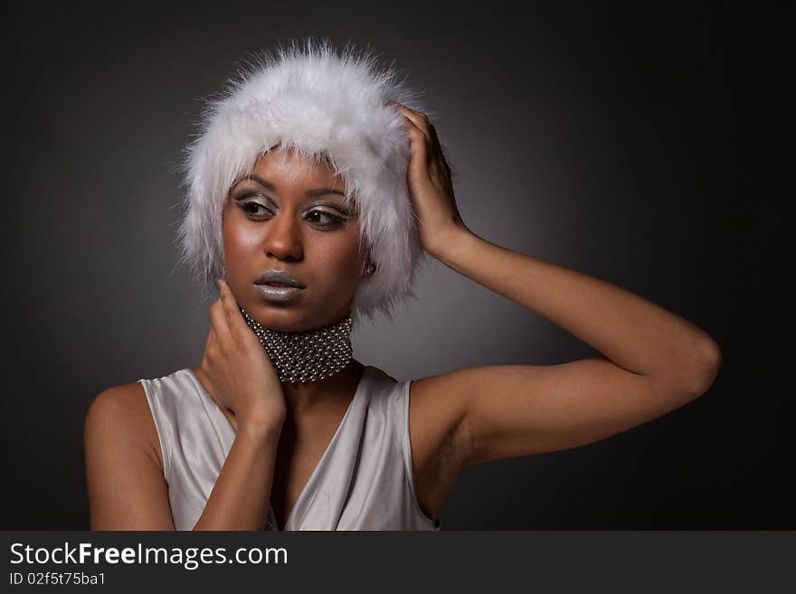 Beautiful afro-american woman portrait in big white hat. Beautiful afro-american woman portrait in big white hat