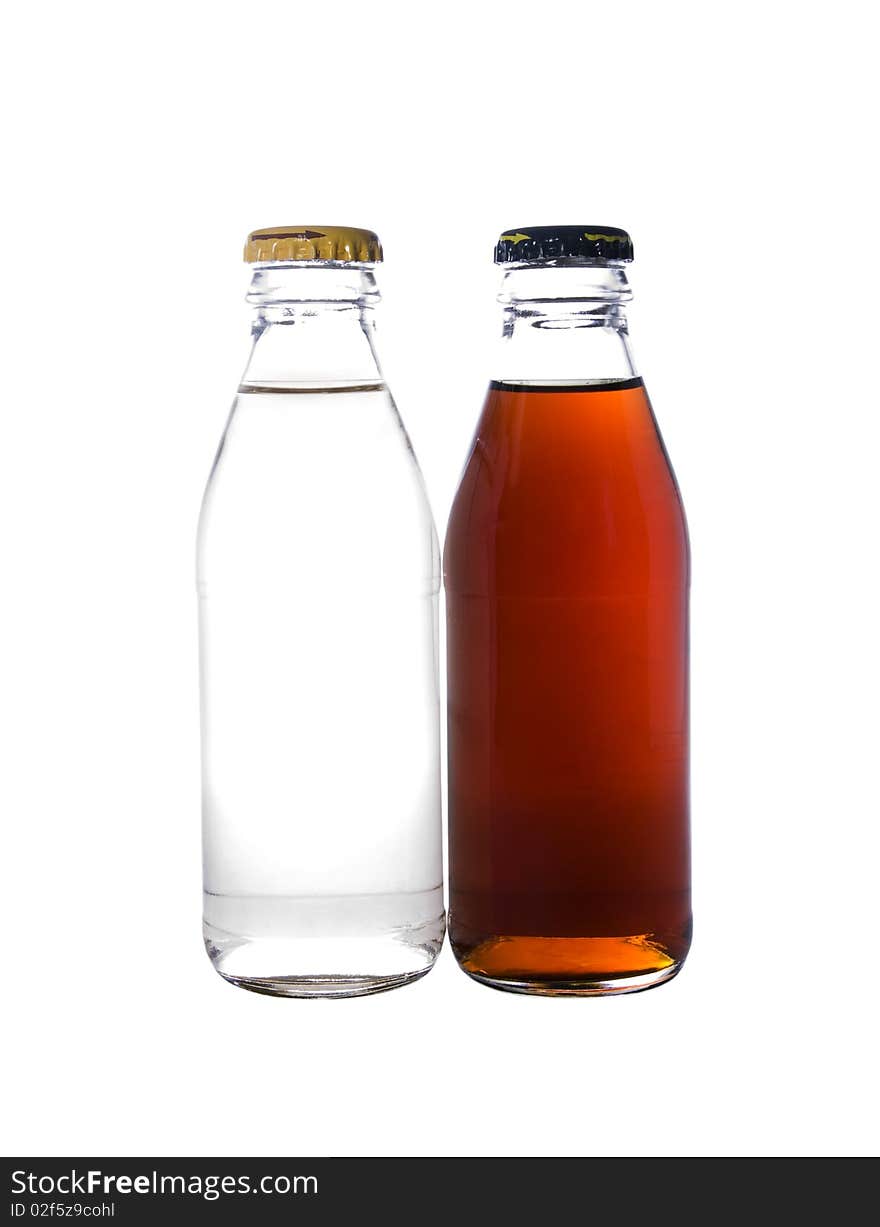 Two glass bottles filled with a liquid isolated on a white background