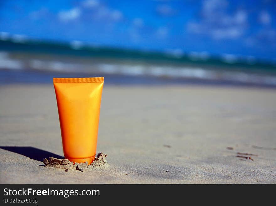 Tube with sun protection on beach of ocean