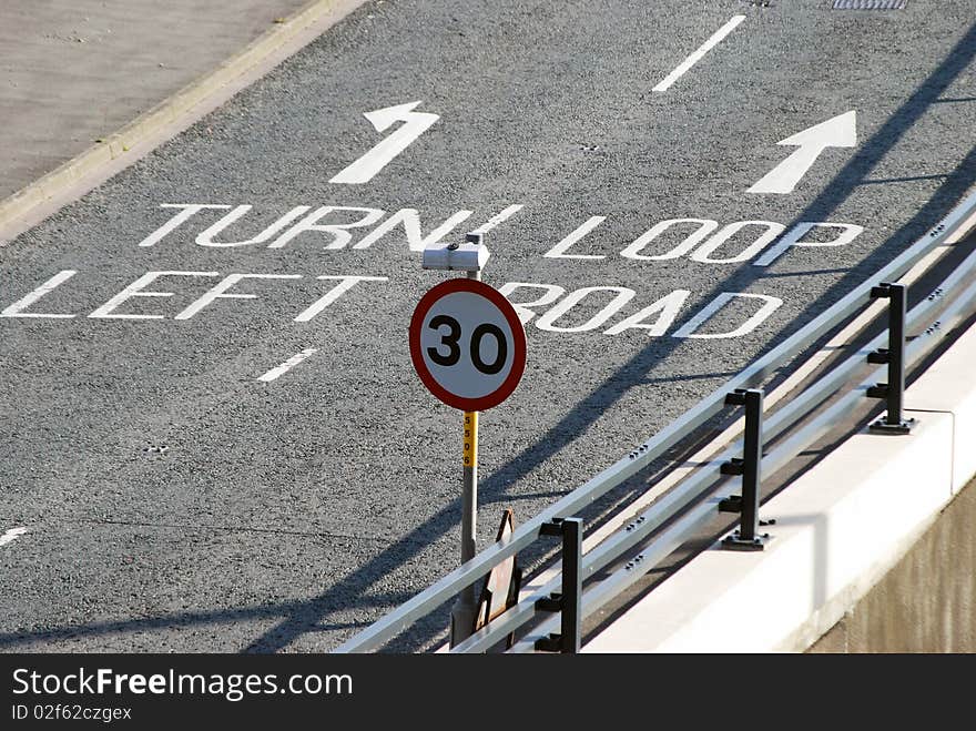 Closeup of empty road showing direction arrows. Closeup of empty road showing direction arrows