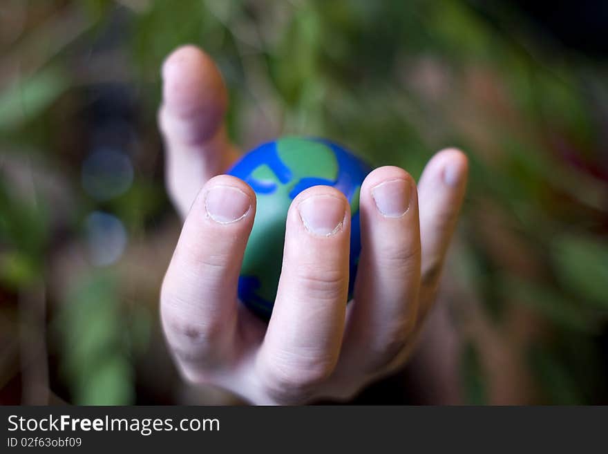 Ecological vision where human hand squeeze our planet. Ecological vision where human hand squeeze our planet