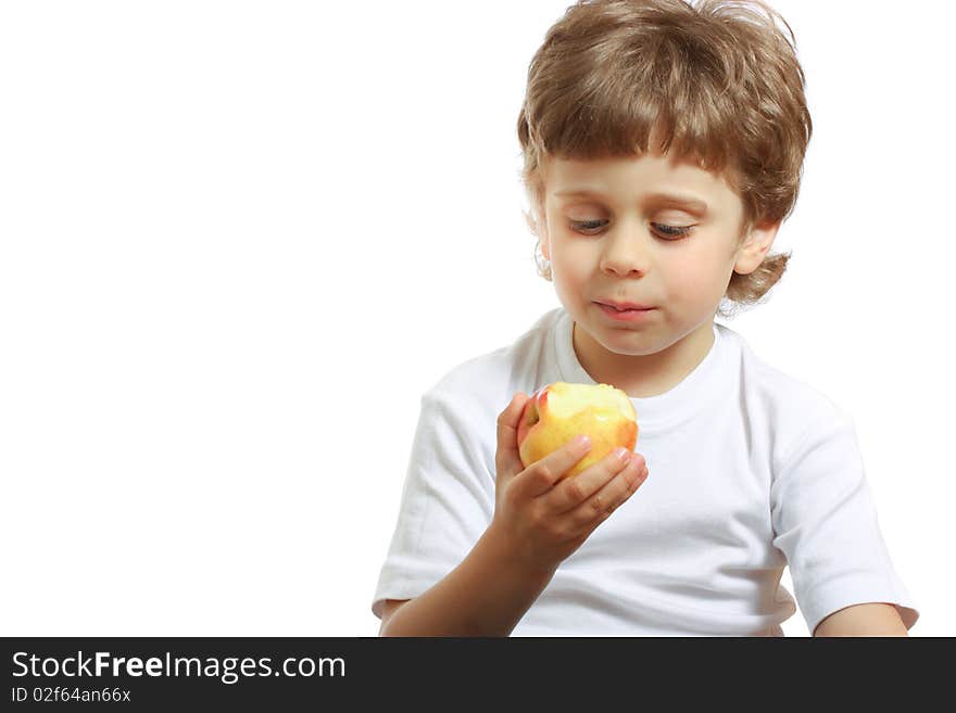 Little beautiful child playing and eating an apple - isolated on white. Little beautiful child playing and eating an apple - isolated on white