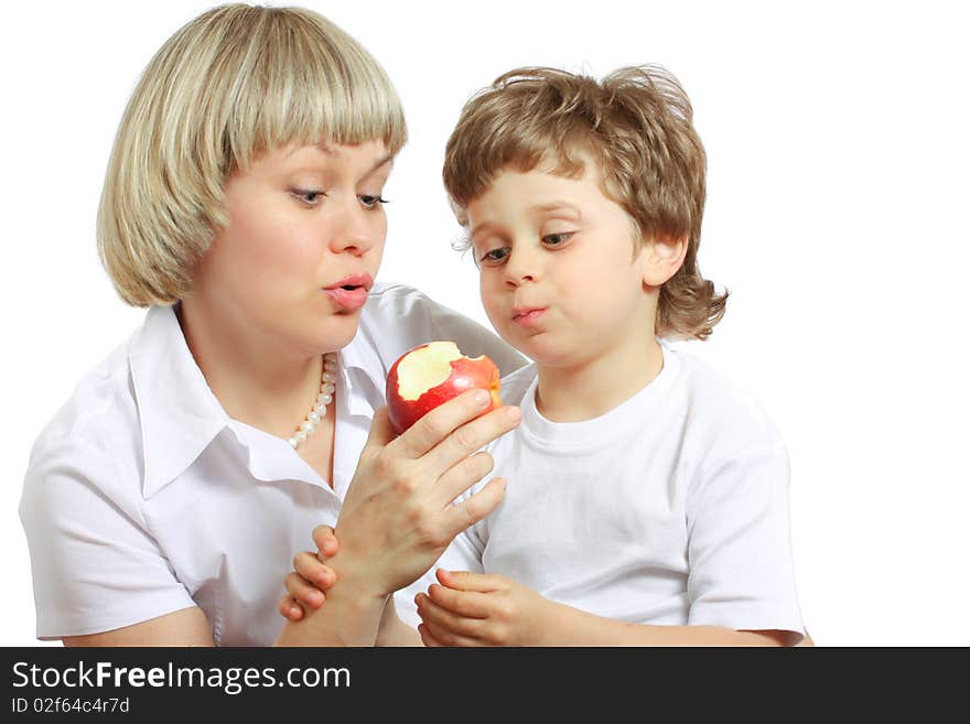 Woman and little boy playing and eating an apple. Woman and little boy playing and eating an apple