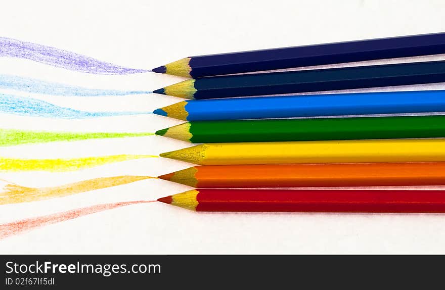 Crayons with drawn trace from them on the white background. Crayons with drawn trace from them on the white background