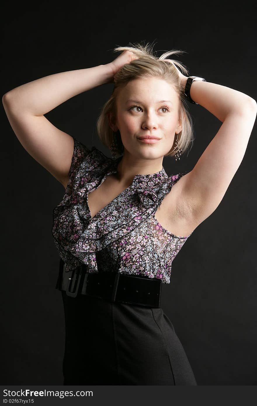 Portrait of the beautiful, young girl-blonde in a black-and-white dress. Portrait of the beautiful, young girl-blonde in a black-and-white dress