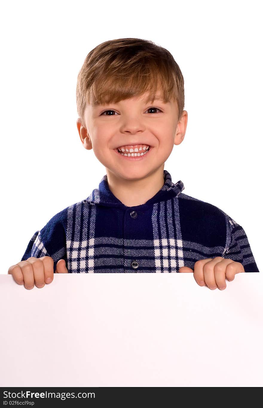 Funny little boy holding a blank white sign for your message. Good for borders of articles or websites. Beautiful caucasian model. Isolated on white background.