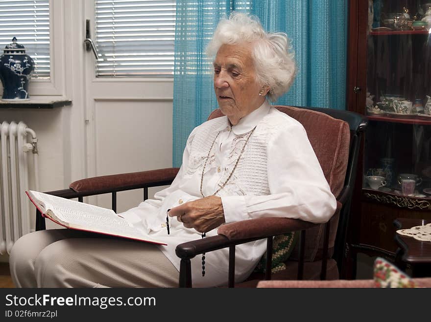 Portrait of senior woman reading the bible. Portrait of senior woman reading the bible