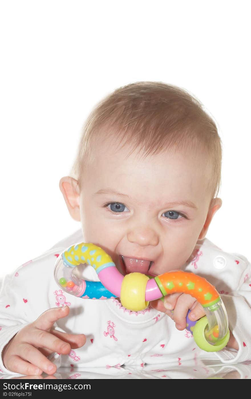 Portrait of the newborn child with a toy in a hand. Portrait of the newborn child with a toy in a hand