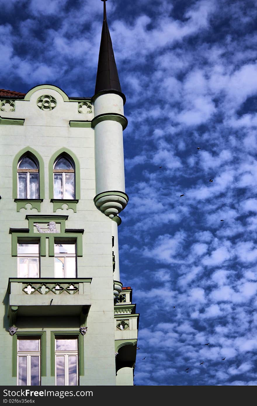 Facade of a building against the blue sky. Facade of a building against the blue sky