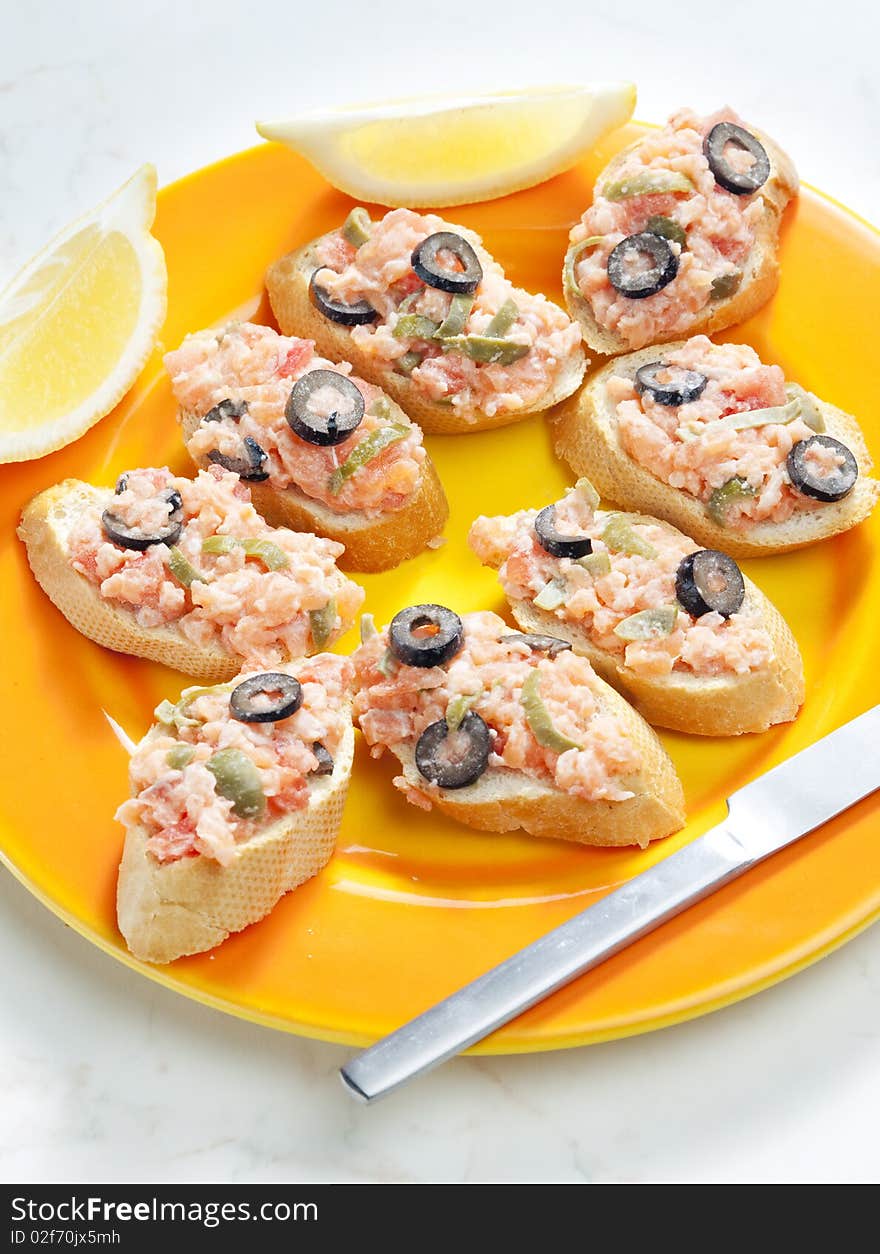 Salmon tartare with capers and black olives