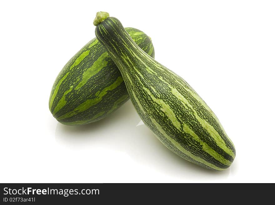 Green zucchinis on white background, clipping path