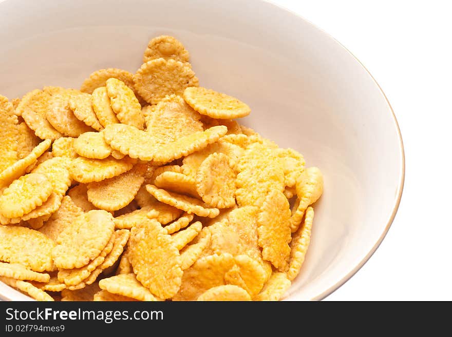 Corn-flakes on white plate.