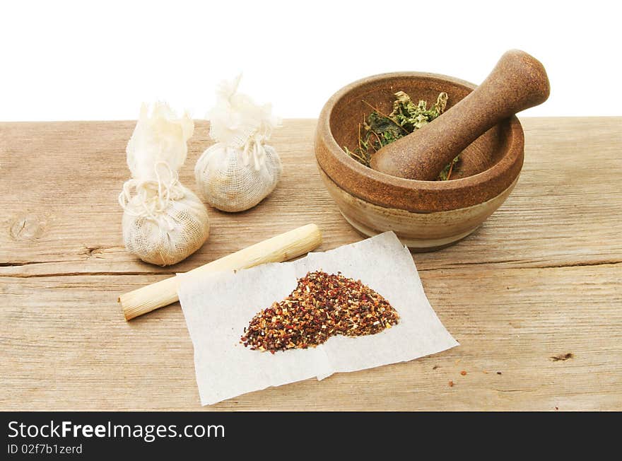 Herbal preparation and ingredients on a wooden board. Herbal preparation and ingredients on a wooden board