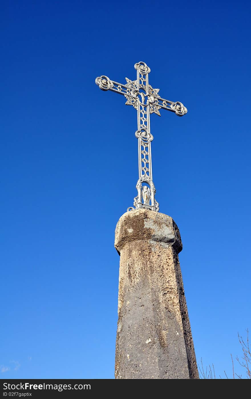 Cross in a blue sky setting in mountain