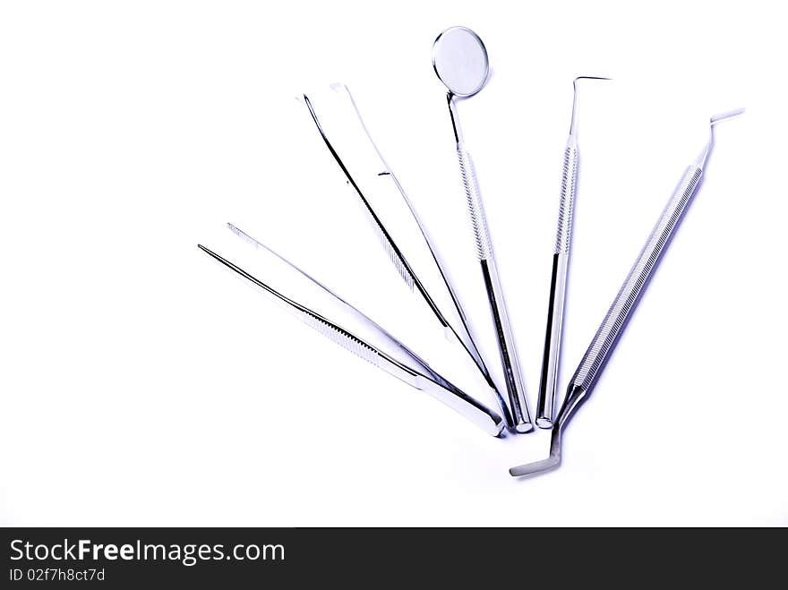 Dental tools on white background