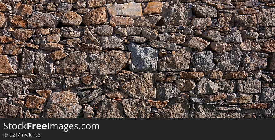 Background in the form of stone rustic walls. Background in the form of stone rustic walls