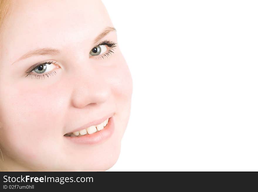 Close-up of smiling Teenager girl looking on the white background