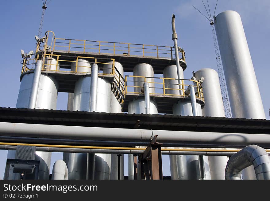 Plant piping aginst blue sky