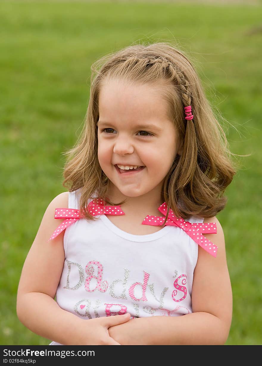 Little Girl Playing Outside With Big Smile