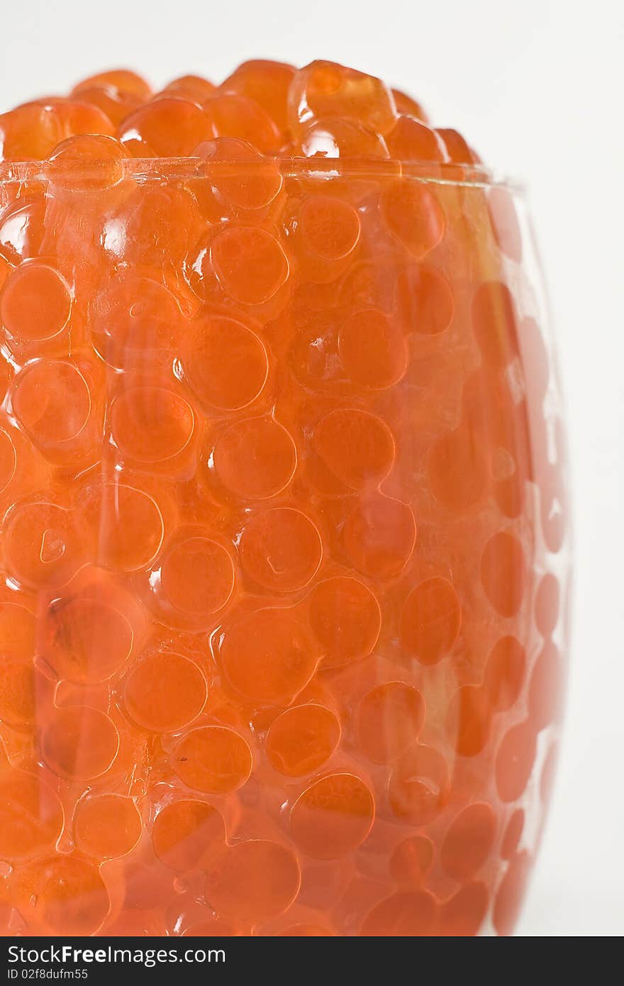 Red caviar in a transparent glass