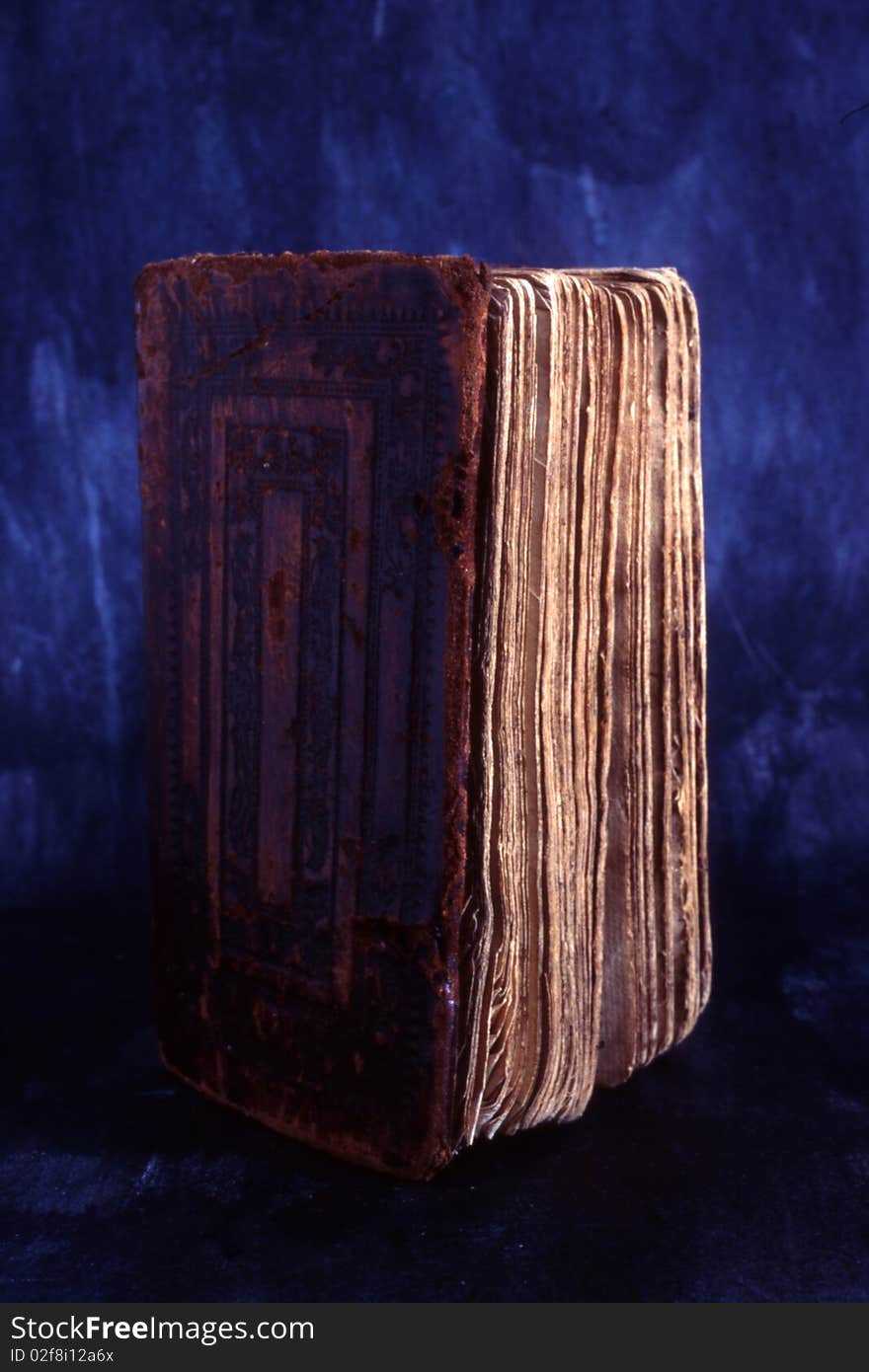 An old book isolated on painted background