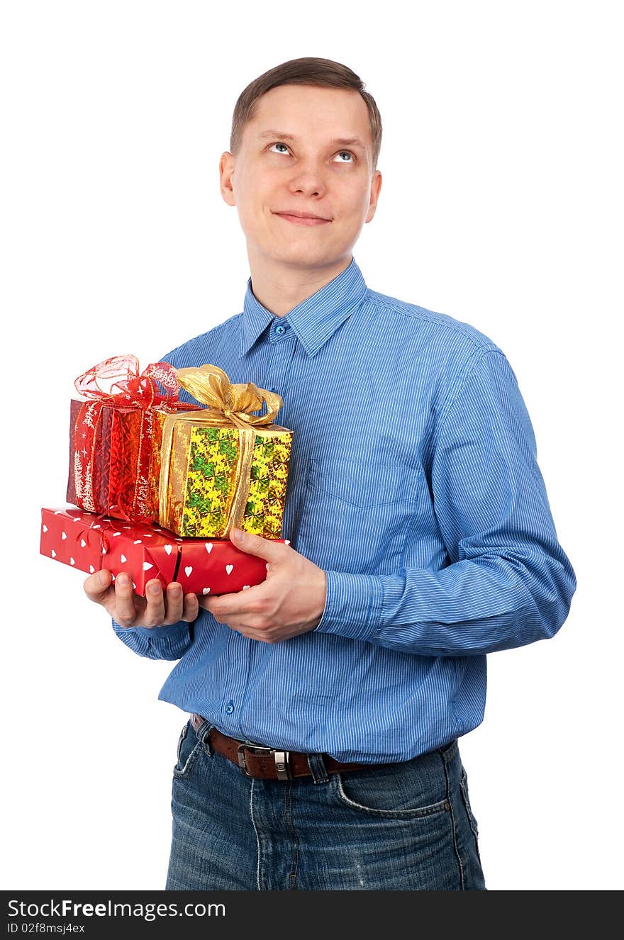 Young man with gift boxes isolated on a white background