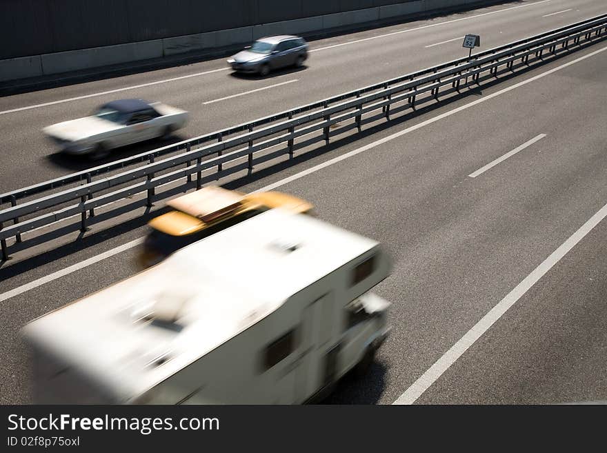 Fast-moving vehicles on the highway.