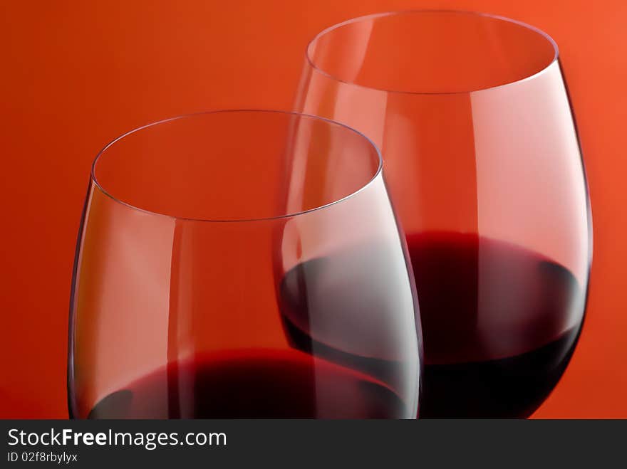 Two wineglass on a red background. Two wineglass on a red background