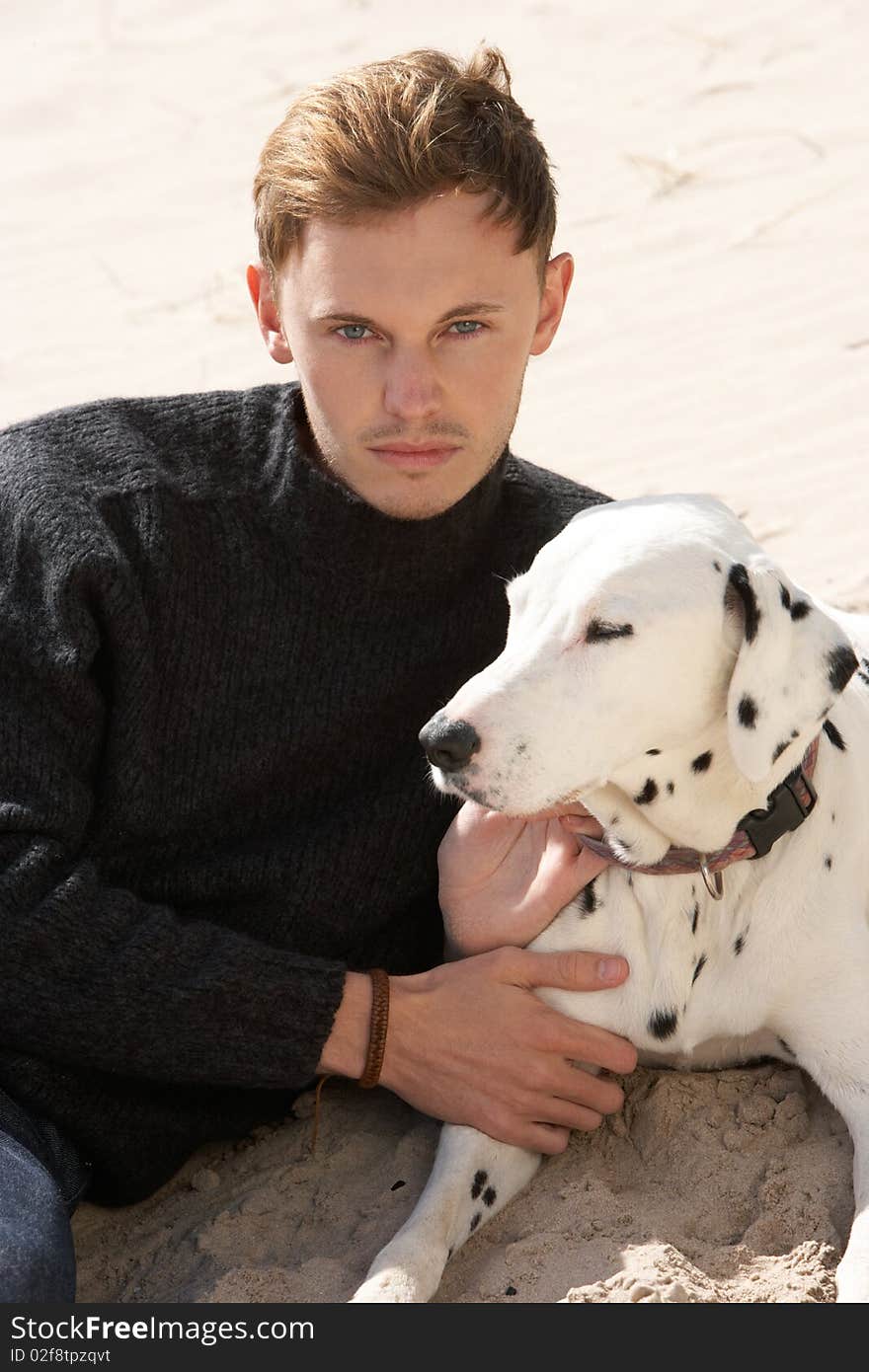 Teenage Boy On Beach With Dog