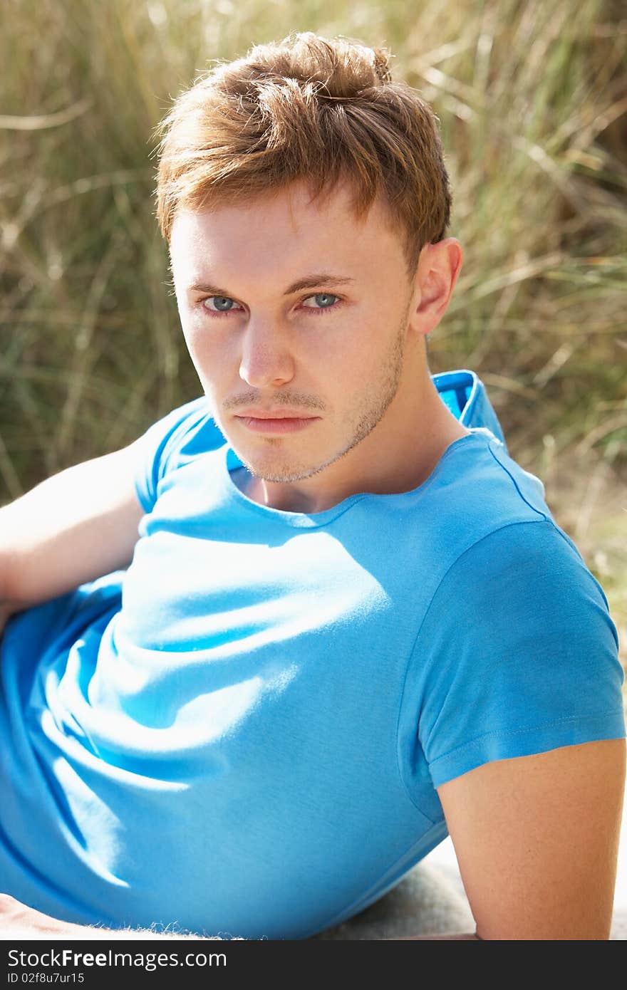 Portrait Of Young Man On Beach