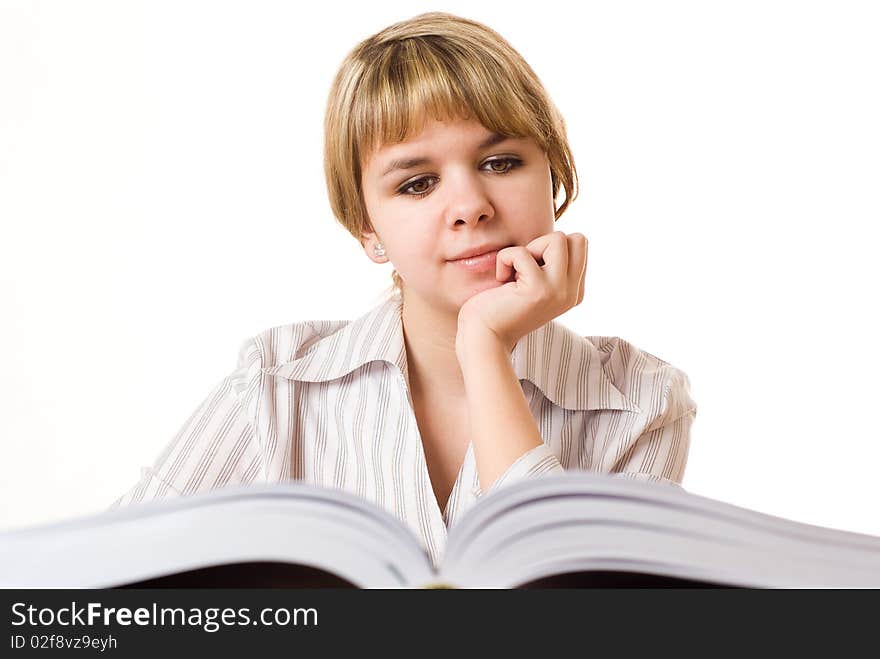 Beautiful young girl with a book on white