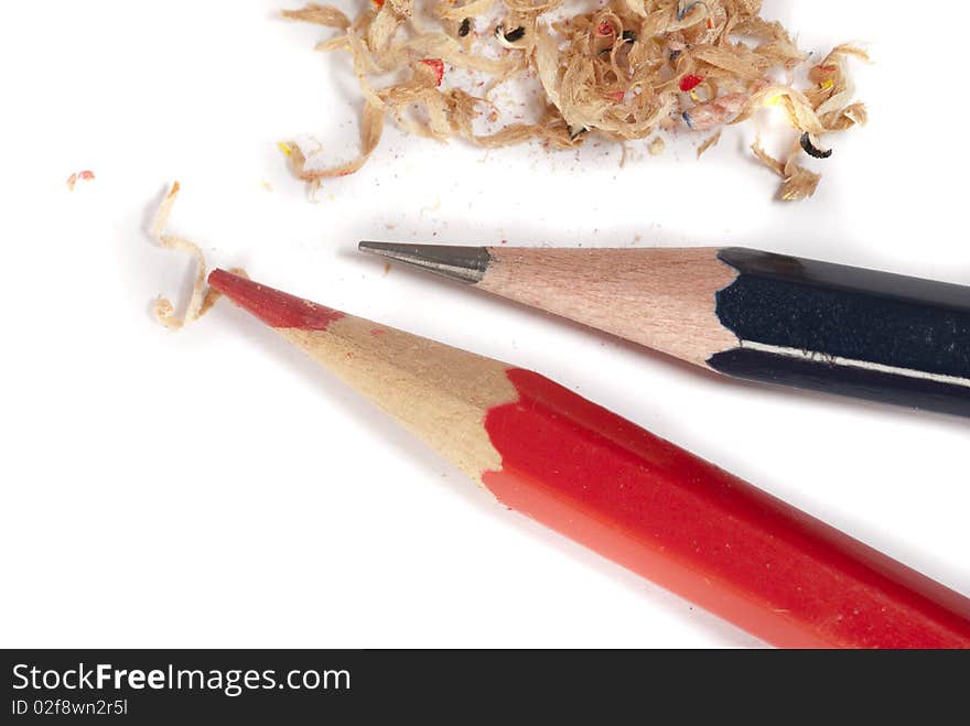 Closeup of lead pencil and red pencil along with shavings. Closeup of lead pencil and red pencil along with shavings