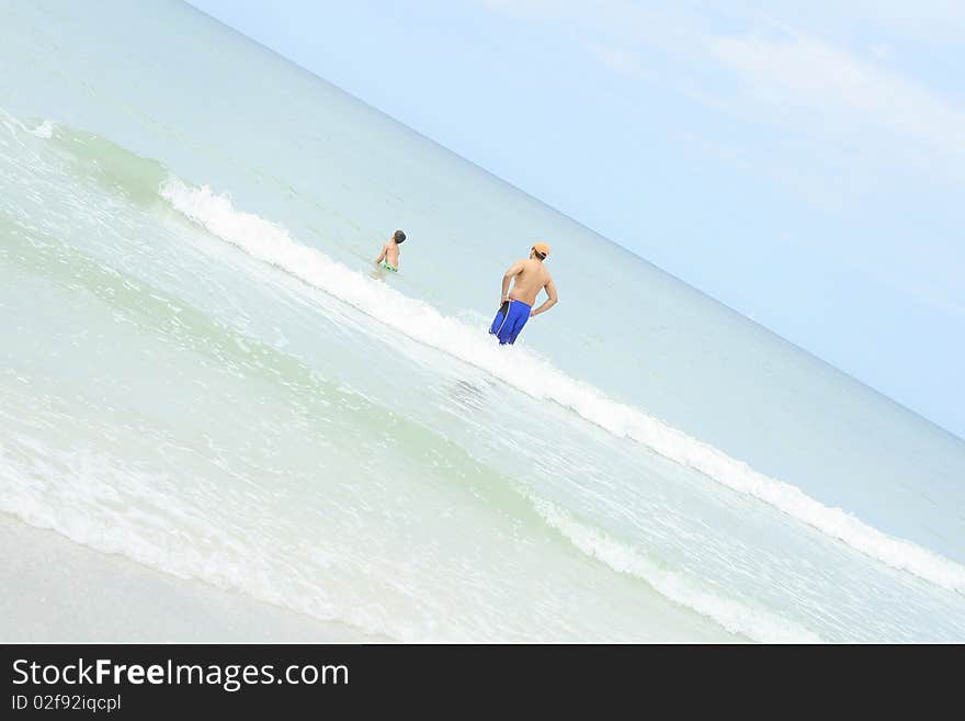 Father And Son In The Ocean Angle