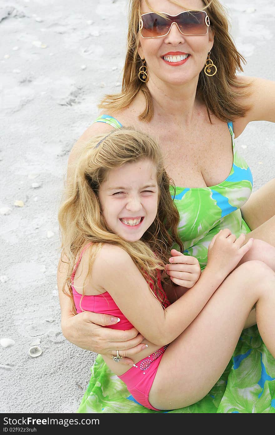 Grandma & cute little girl at the beach