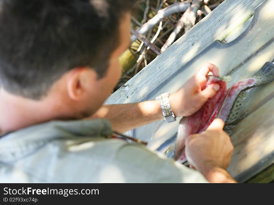 Man cleaning a fish