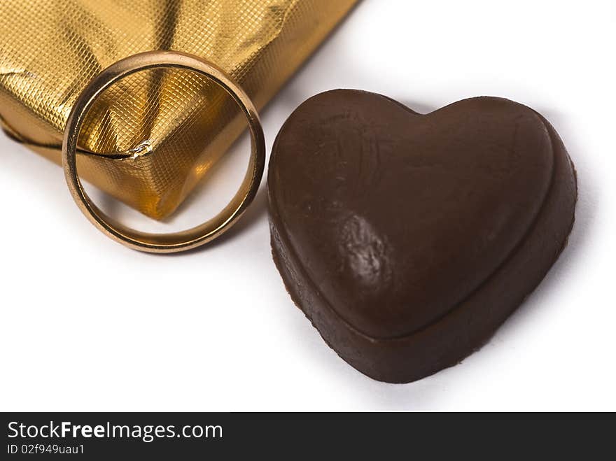 Sweet love - the heart shaped chocolate and a ring