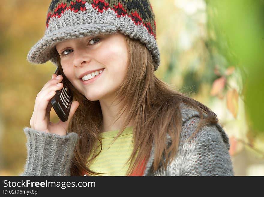 Young Girl Outside Using Mobile