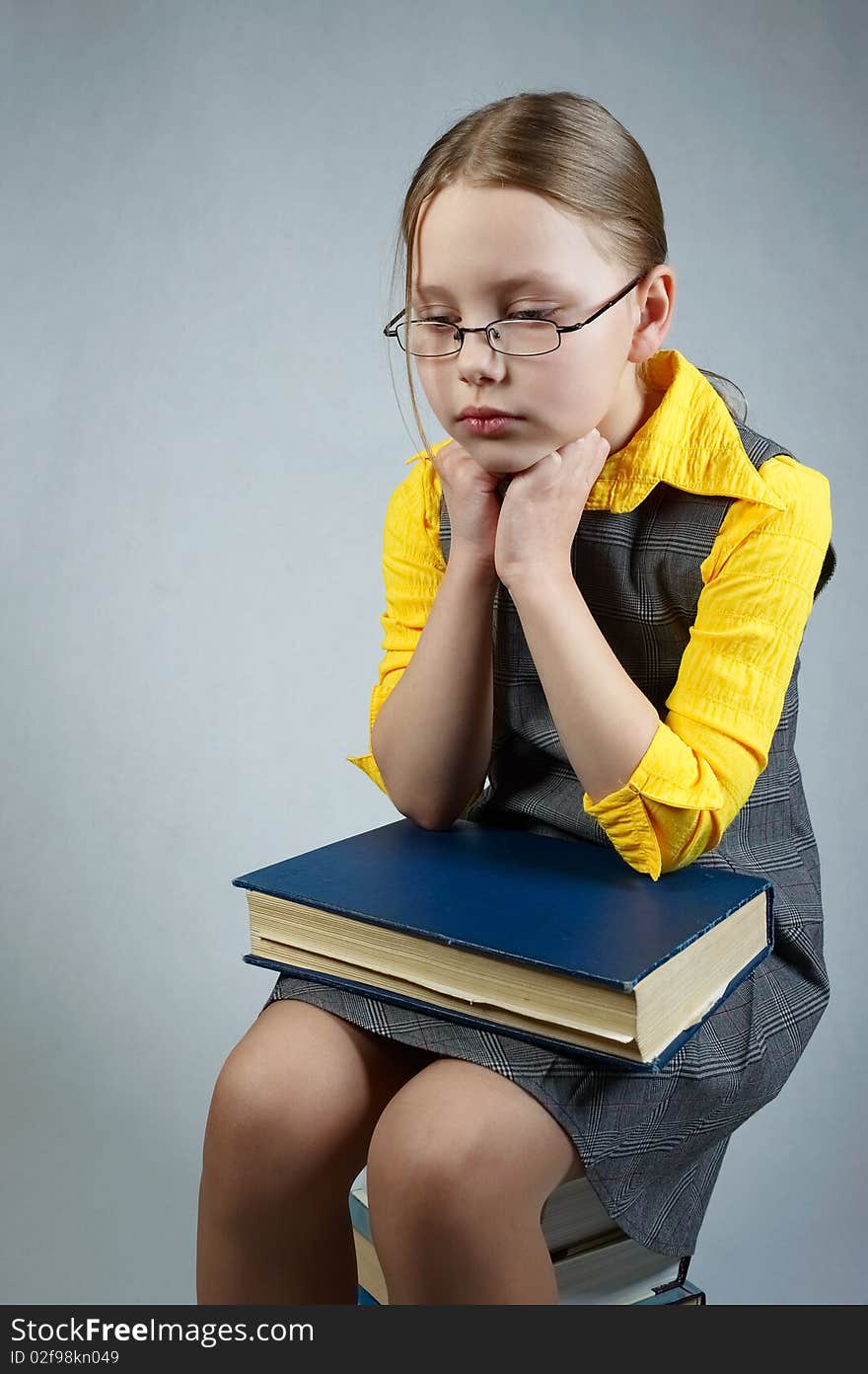 Little pupil  girl with books