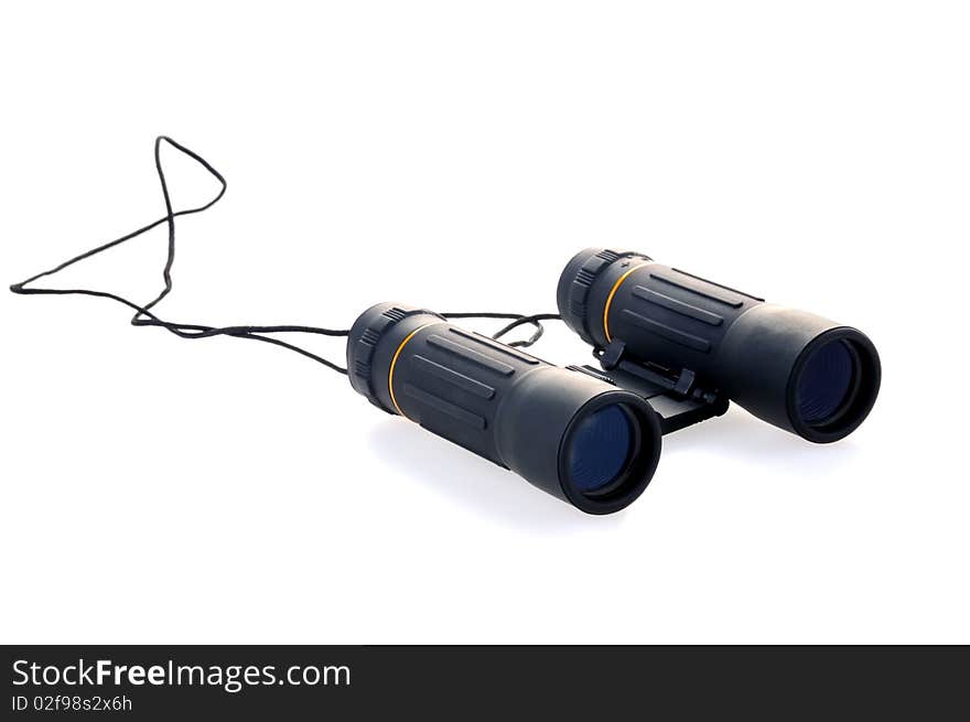 Black binoculars isolated with soft shadows on white background. Image with clipping pathes with and without shadows