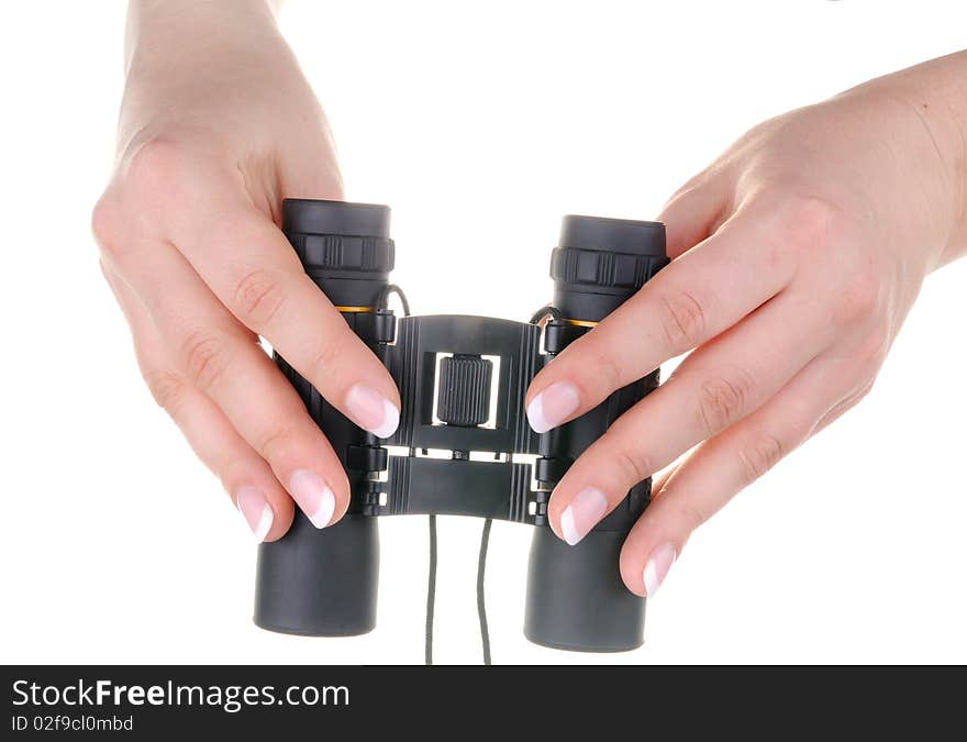 Black binoculars in female hands on white background. Black binoculars in female hands on white background