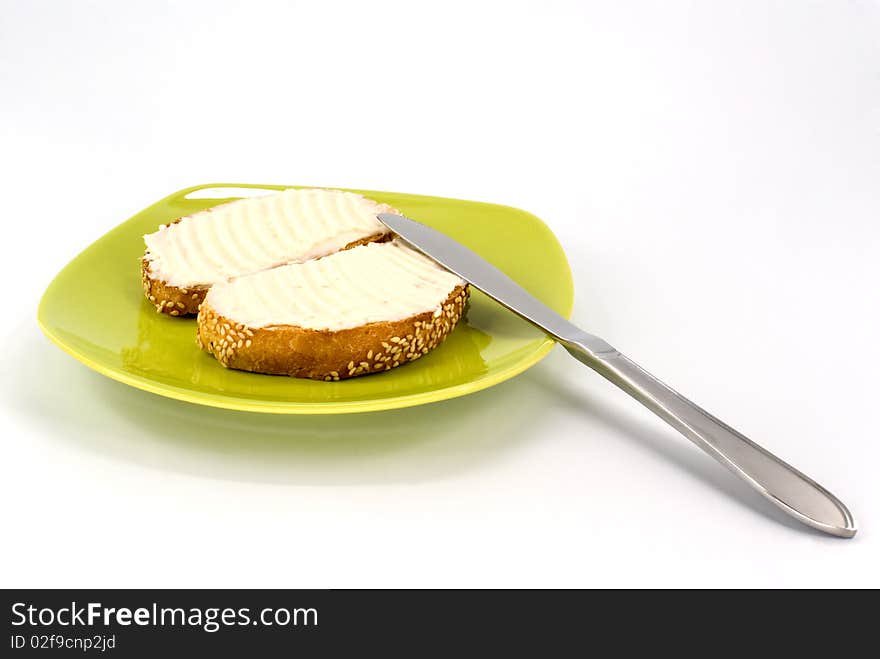 Toasted piece of bread with butter on plate