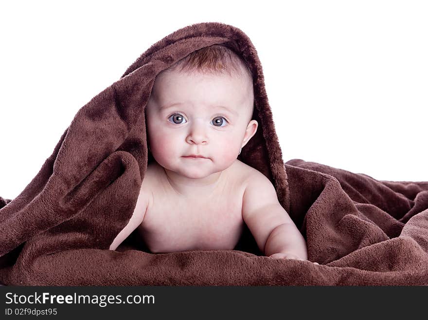 A Beautiful Baby Under A Brown Towel