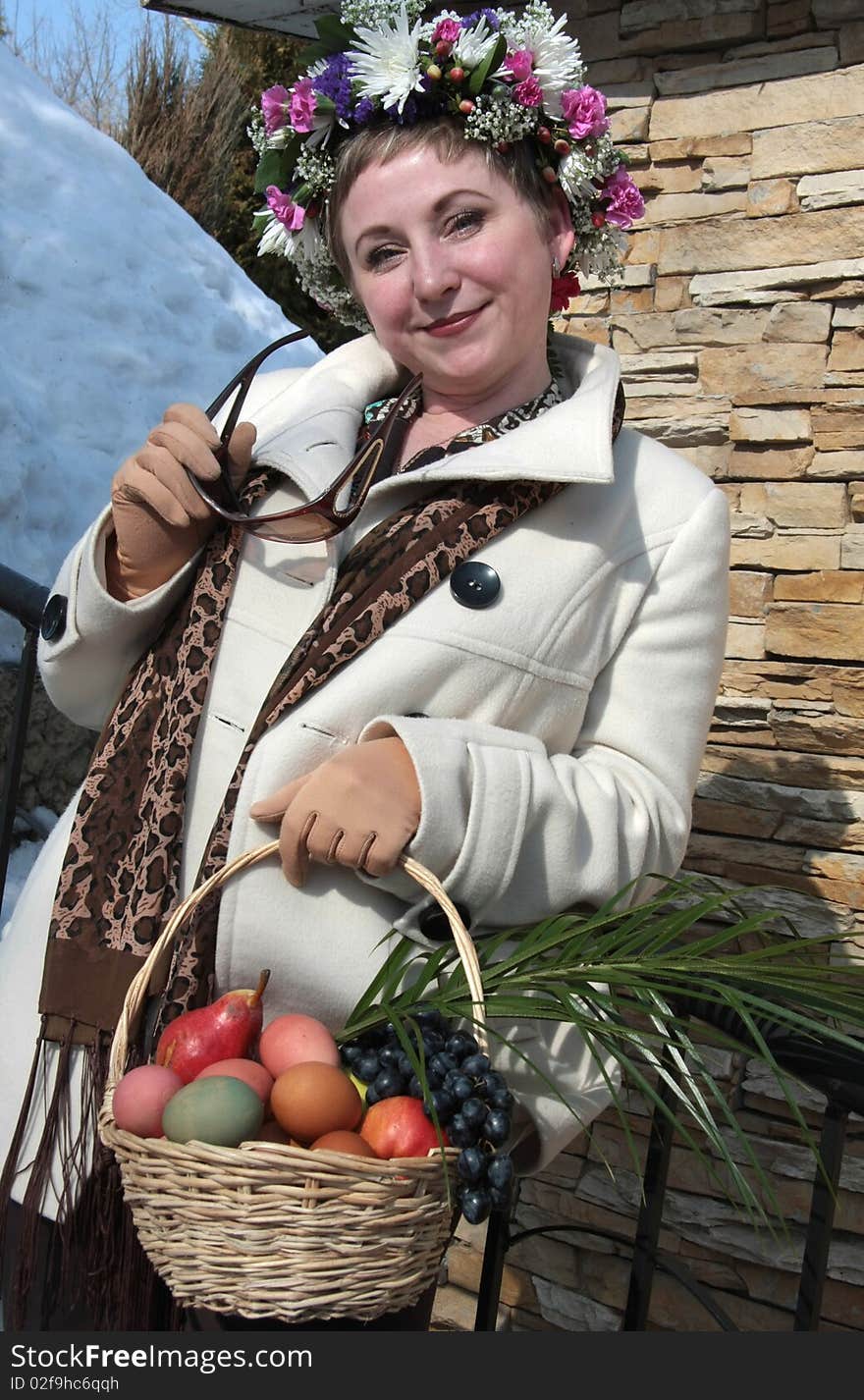 A girl wearing a crown with Easter basket