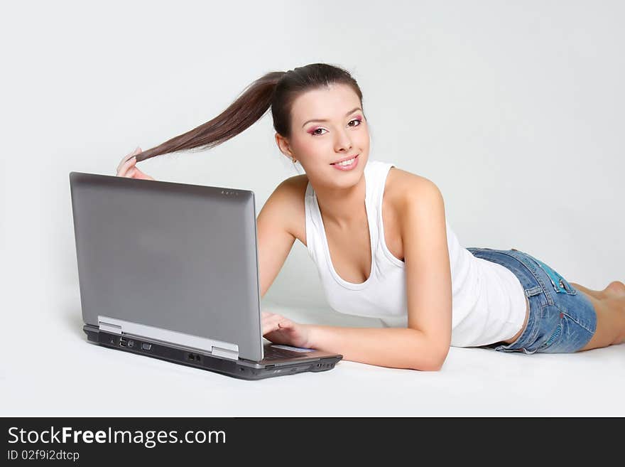 Young attractive girl with laptop. Young attractive girl with laptop