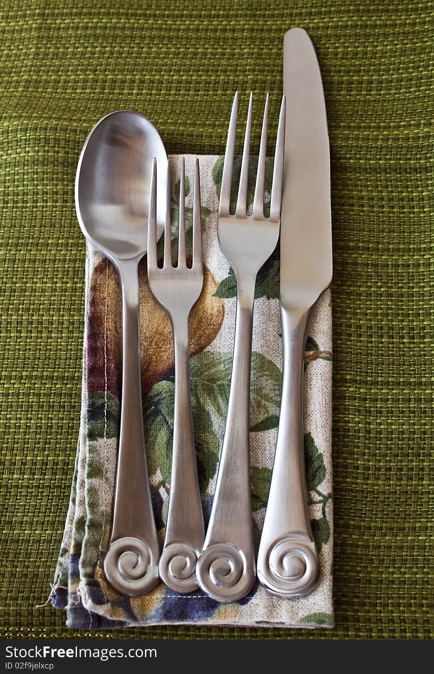 Silverware on napkin and table cloth. Silverware on napkin and table cloth