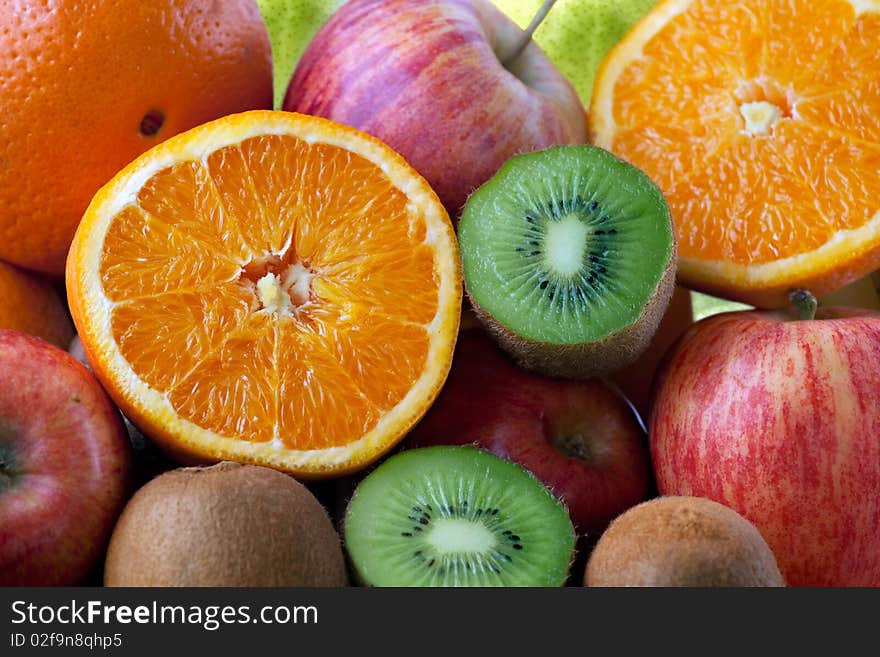 Orange, Apple, Kiwi Fruits Background full Frame. Orange, Apple, Kiwi Fruits Background full Frame