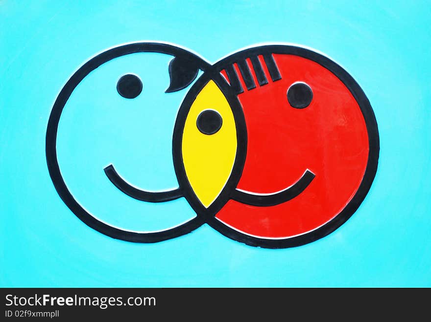 A round face boy and girl sign in a playground for kids.