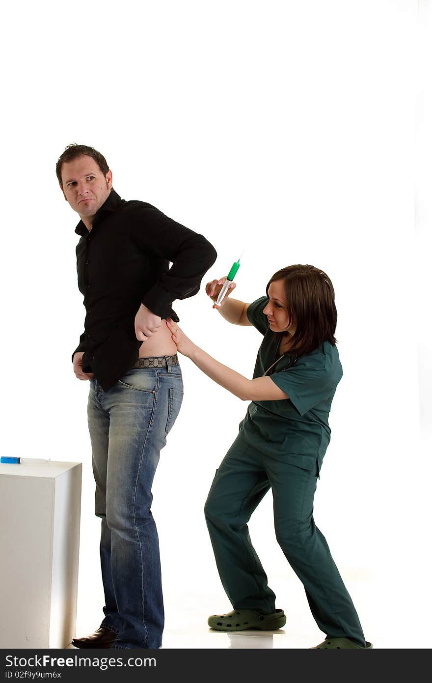 Photo of doctor healing patient with syringe. Photo of doctor healing patient with syringe