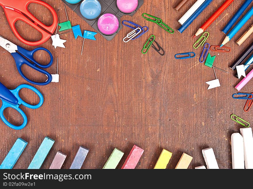 Office tools on wooden board