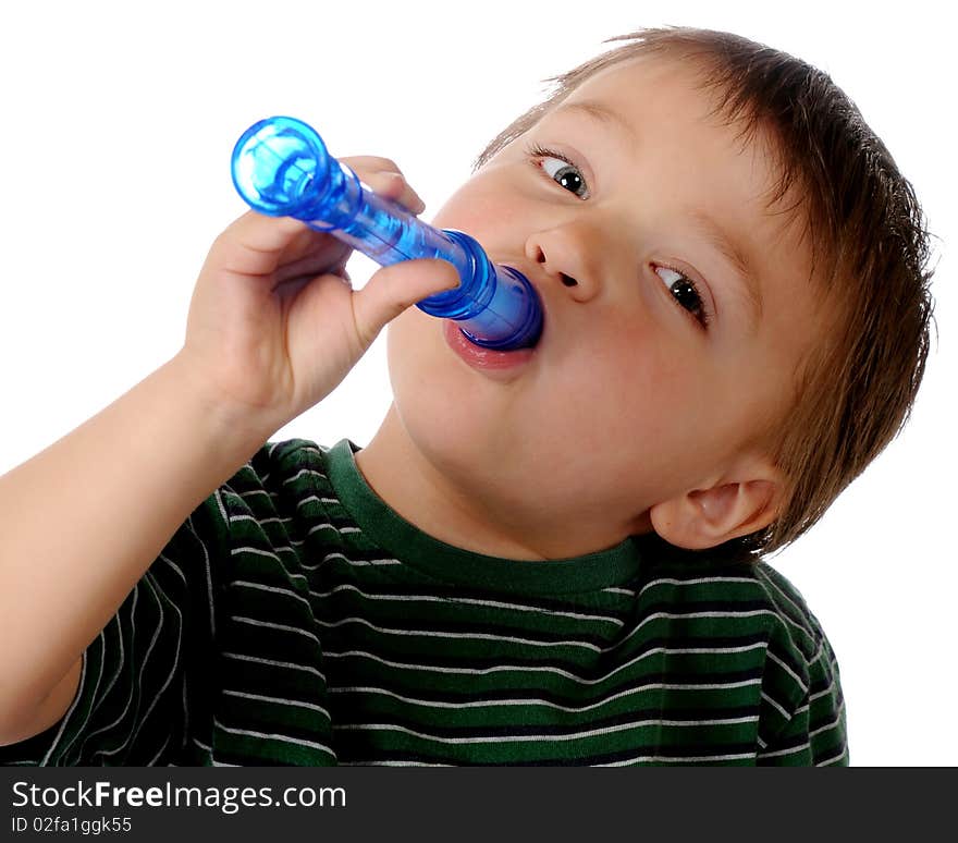 Closeup of a preschool boy playing a blue recorder. Isolated on white. Closeup of a preschool boy playing a blue recorder. Isolated on white.